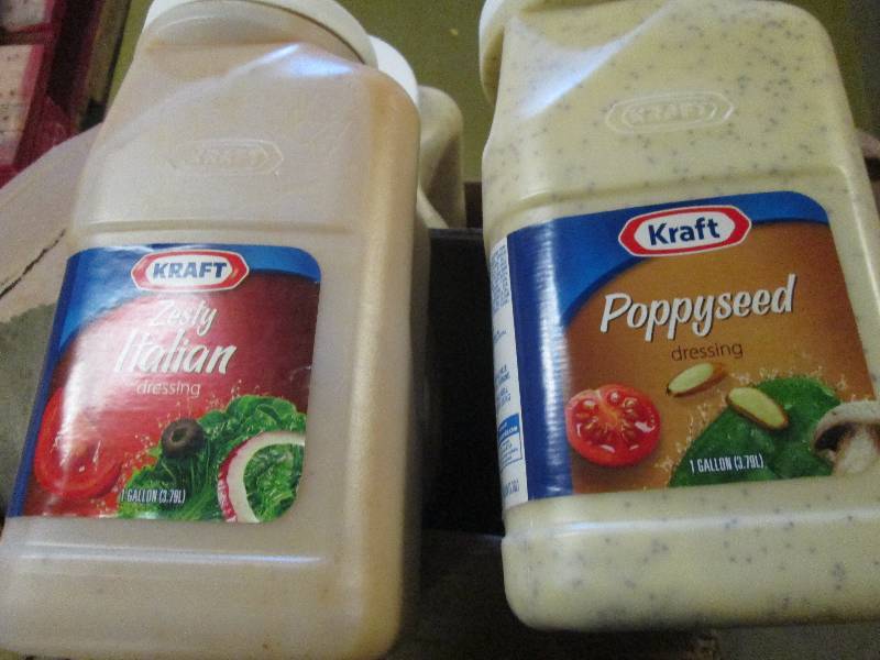 lot 129 image: 4 1 gallon bottles of dressing 2 ze...