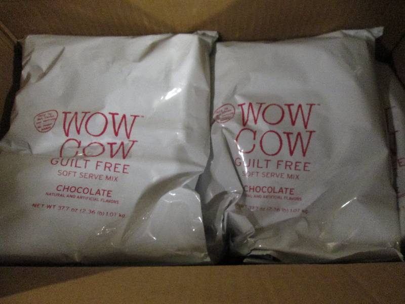 lot 297 image: 1 case of 82.36lb bags of wow cow ...