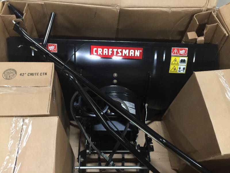 lot 106 image: Craftsman Dual-Stage Snow Blower Tractor Attachment open box never used