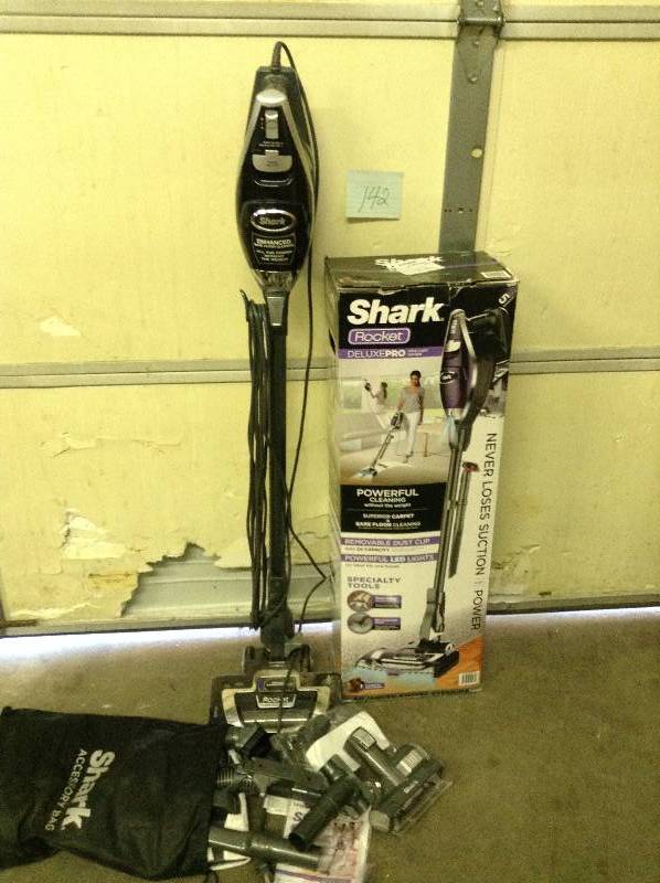 lot 142 image: Shark Rocket Deluxe Pro Ultra-light Uprightstick Vacuum Tool Bundle in working conditions