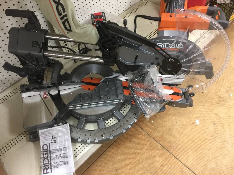 lot 171 image: RIDGID 15 Amp 12 in. Corded Dual Bevel Sliding Miter Saw with 70 Degree Miter Capacity Model#  R4221 OPEN BOX NEVER USED