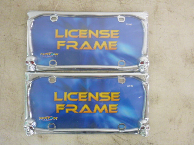 lot 64 image: 2 Skull License Plate Frames