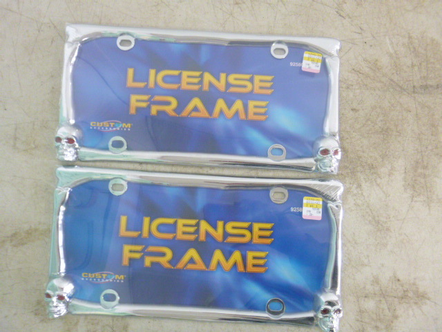 lot 65 image: 2 Skull License Plate Frames