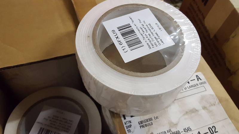 lot 79 image: Case of white lane marking tape.