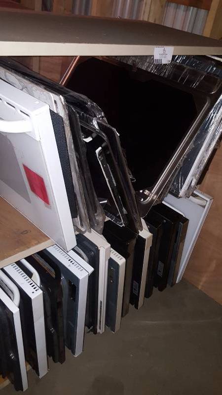 lot 136 image: 14 used oven doors and several glass cooking tops