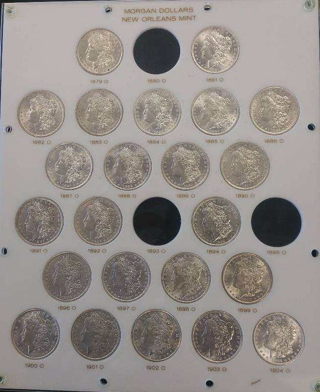 GROUP OF 23 HIGH GRADE NEW ORLEANS MORGAN SILVER DOLLARS IN CAPITAL PLASTICS HOLDER