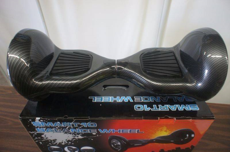 lot 31 image: NEW - 10 Smart Balance Wheel - Hoverboard - Real Rubber Tires - Black  Grey Color - Bluetooth Compatible - Remote - Charger - MSRP $899.99