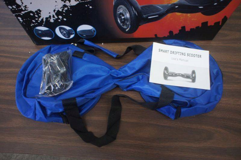 lot 32 image: NEW - 10 Smart Balance Wheel - Hoverboard - Real Rubber Tires - Graffiti Color - Bluetooth Compatible - Remote - Charger - MSRP $899.99