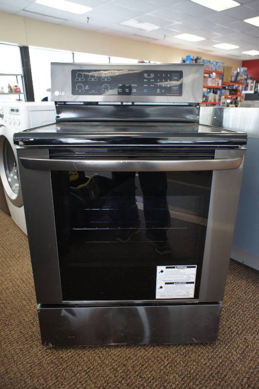 lot 11 image: New - LG 30 Inch Freestanding Electric Range Black Stainless Steel LRE3061BD - Tested Works