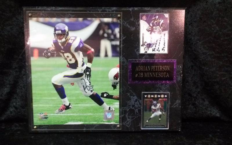 lot 33 image: MN Vikings Adrian Peterson Memorabilia