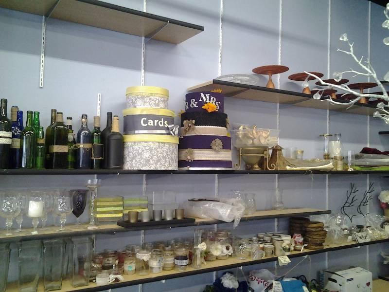 Bottles, Card Boxes, Vases, Cake Stand, Fabric (All On Shelves)