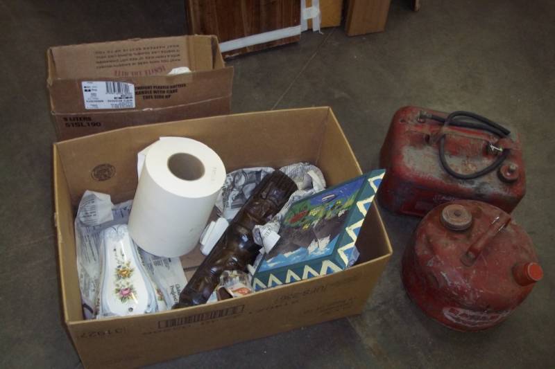 lot 30 image: 2 Gas cans and miscellaneous dcor items