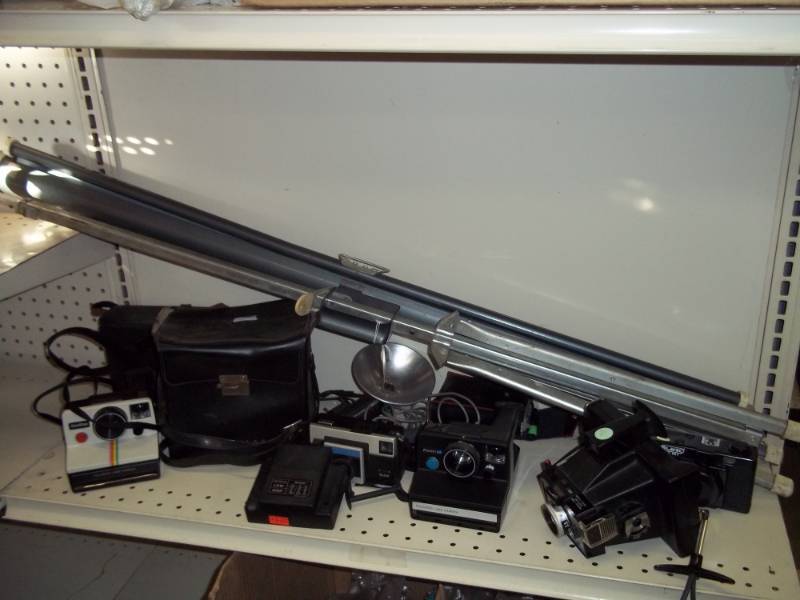 lot 34 image: 3 Vintage Polaroid cameras, camera equipment, slide screen