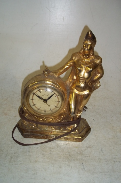 lot 13 image: Antique clock United self starting brand 12 high