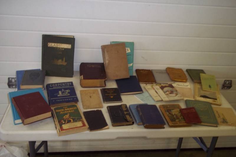 lot 104 image: Large selection of vintage books with copyright back to 1894 leather bound steam engine book, 1928 North American almanac, gold cross WW2 book, poems