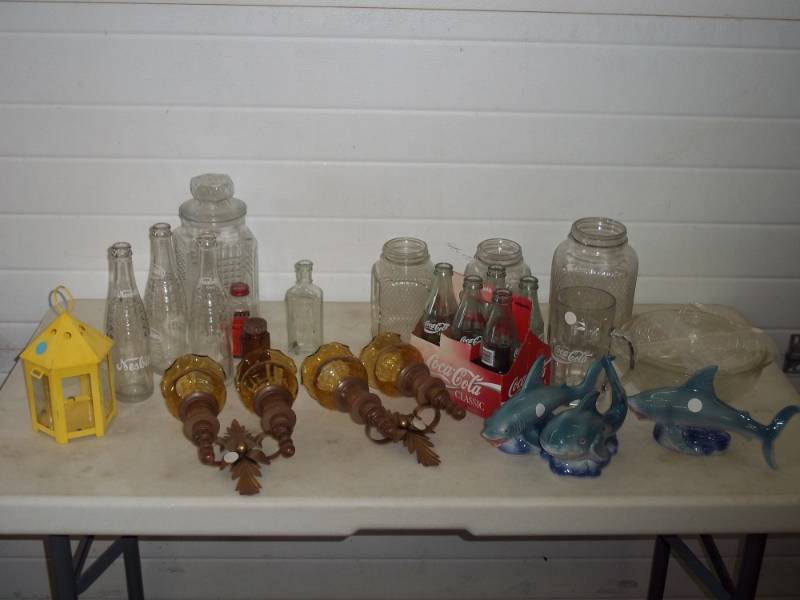 lot 12 image: Assorted glassware, Coca-Cola bottles, Nesbitt bottles, Coca-Cola mug, marine figurines