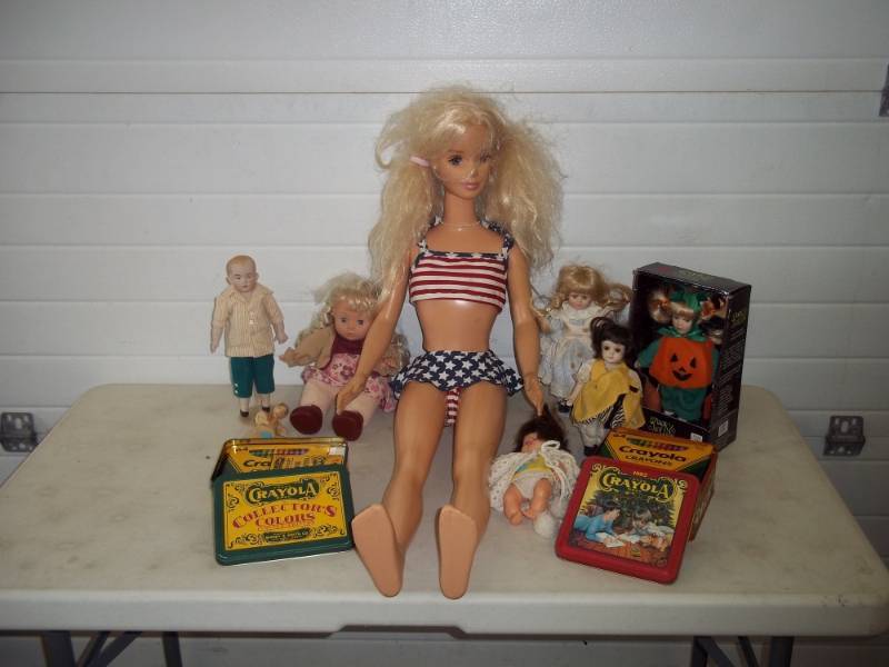 lot 13 image: Assorted dolls, Barbie is 38 tall, 1990s Crayola Crayons tins full of crayons