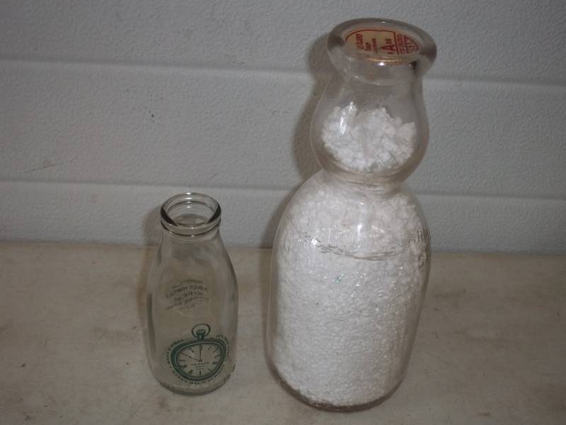 lot 40 image: Vintage milk bottles, Chevy Chase Washington D.C., other made in England