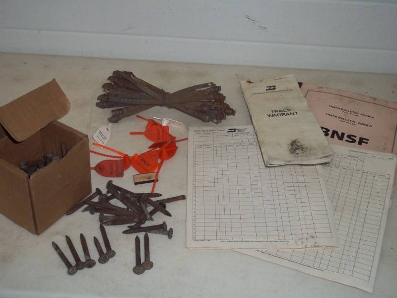 lot 44 image: Railroad Items Car ties, Burlington Northern car tages, Tie Nails, paperwork