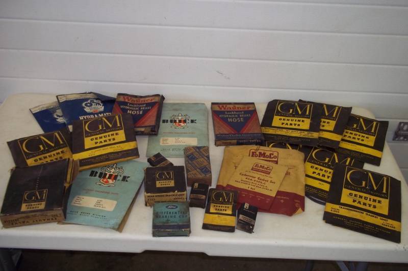 lot 79 image: Vintage GM and Ford auto parts, carbuerator gaskets, transmission gaskets, bearing cups
