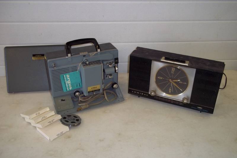 lot 90 image: Vintage Argus 8 mm projector, 8mm movies Popeye, Chaplain and more, Admiral radio
