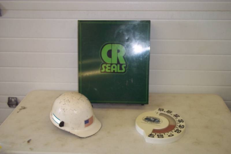 lot 97 image: CR Seals supply cabinet, MN outdoor thermometer, vintage fiberglass hardhat