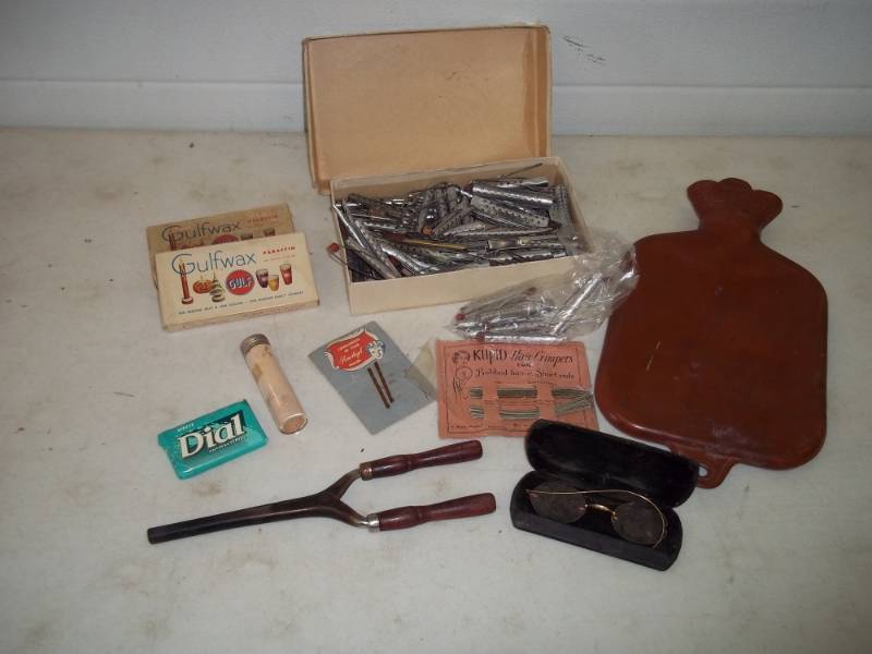 lot 113 image: Vintage hair curlers, beauty supplies, hot water bottle
