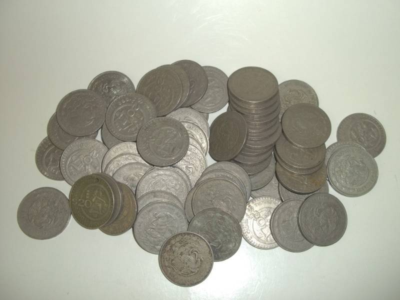 lot 5 image: Sixty Two $20 Pecos Mexican coins, mixed dates