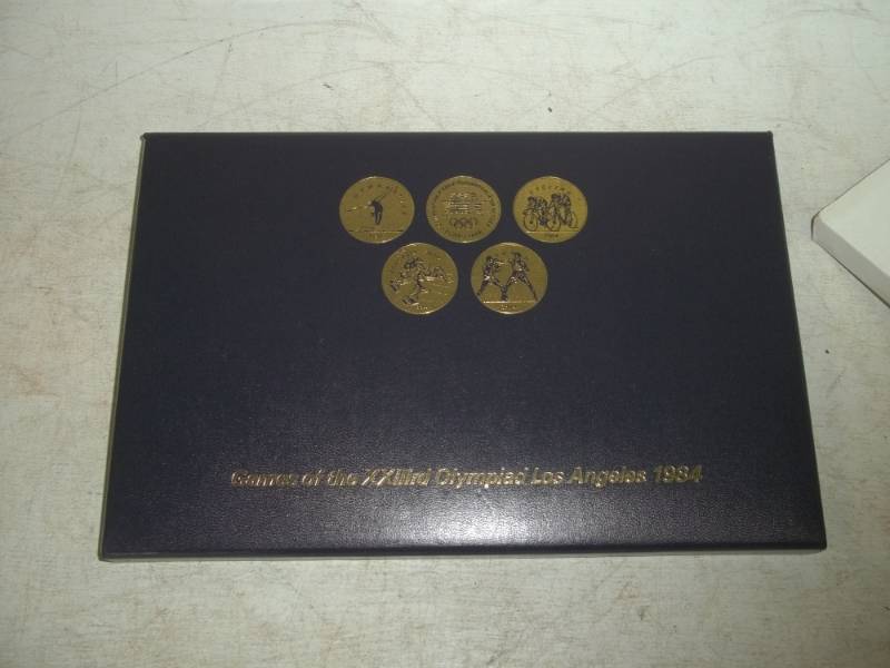 lot 15 image: Commemorative tokens XX111rd Olympiad Los Angeles 1984