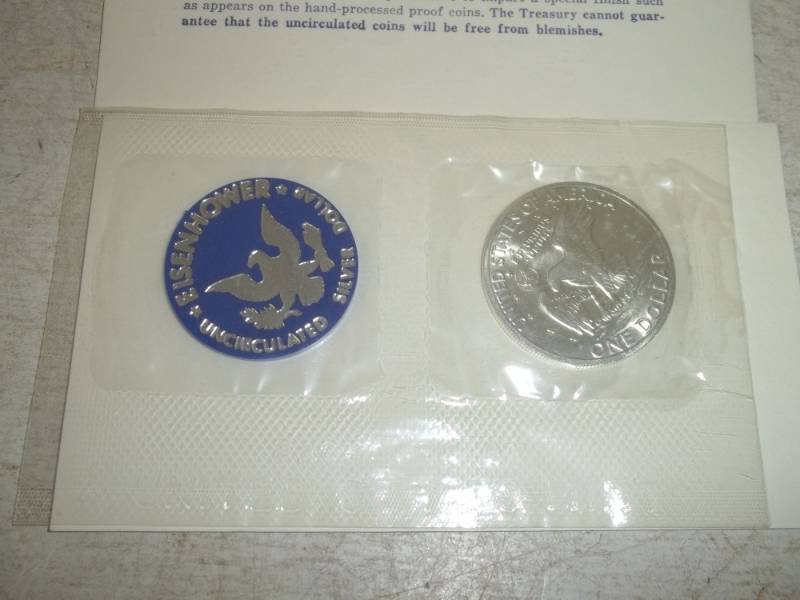 lot 23 image: 971 Eisenhower Silver dollar with certificate, uncirculated, %40 silver