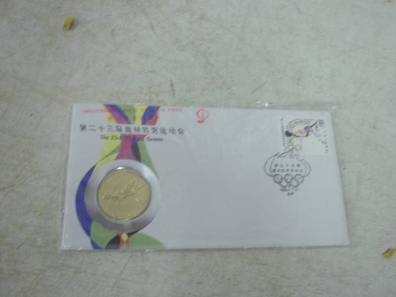 lot 98 image: 23rd Olympic games Los Angeles token and stamp