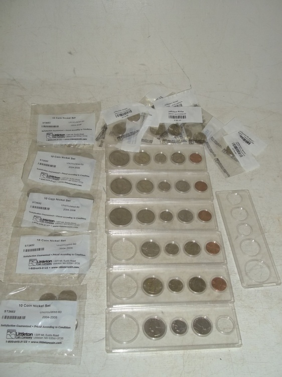 lot 114 image: 13 Single uncirculated nickels, 5 ten packs of uncirculated nickels, all 10 packs are 2004-2006, singles are all Jefferson Nickels, Assorted half dollars, quarters, dimes, nickels and pennies in cases