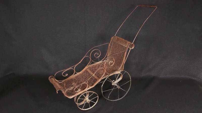 lot 31 image: Antique Doll Stroller  Planter