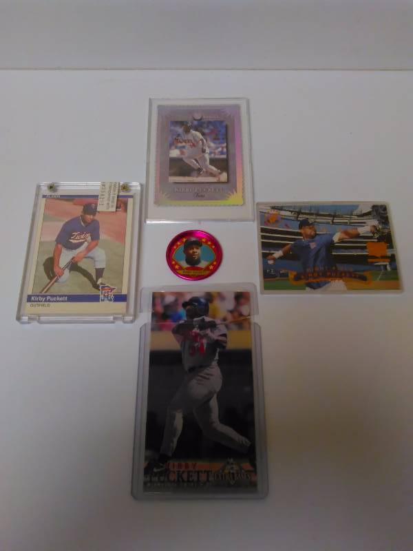 lot 656 image: Kirby Puckett Baseball Cards, Metal Button and Set of 4 cards