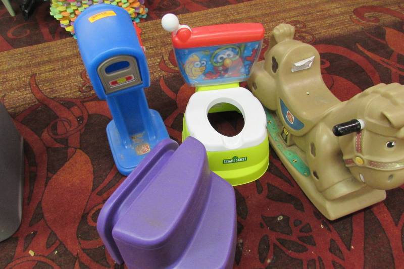 lot 39 image: Ride on rocking horse, step stool, mailbox, and potty chair, missing the bowl
