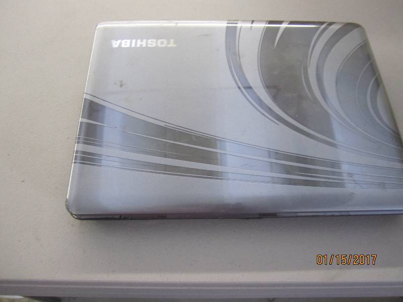 lot 27 image: Toshiba Laptop, powers on, screen O...
