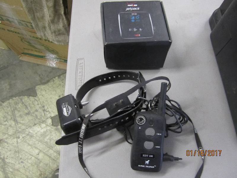 lot 52 image: Verizon Jet Pack, Dog Shock Colar T...