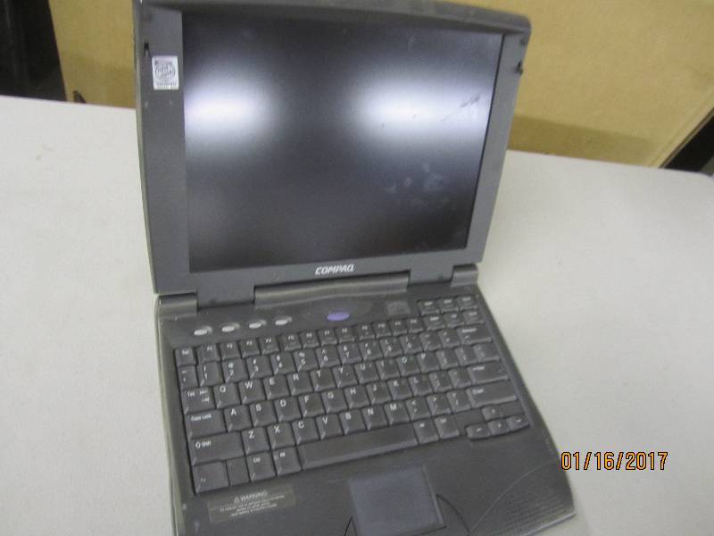 lot 64 image: Compaq  Armada 1573DM laptop, power...