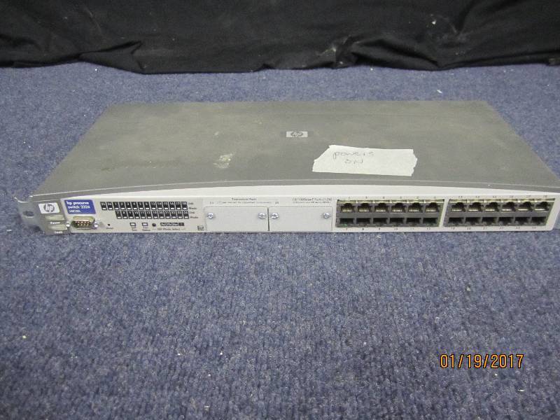 lot 190 image: HP Procurve Switch 2324, powers on...