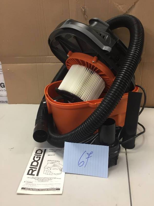 lot 67 image: Ridgid 4 Gal. 5.0-Peak HP Portable Wet Dry Vac Never Used