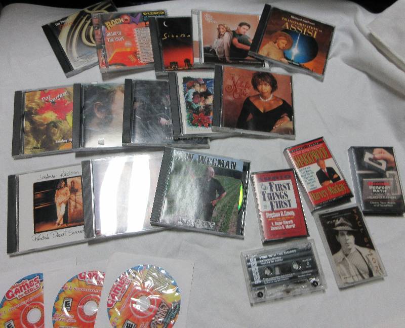 13 CDS, 5 CASSETTES, AND A SET OF 3 DISCS GAMES