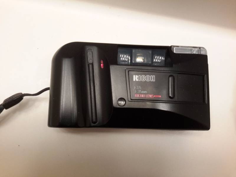 Bushnell binoculars (new).  35mm camera