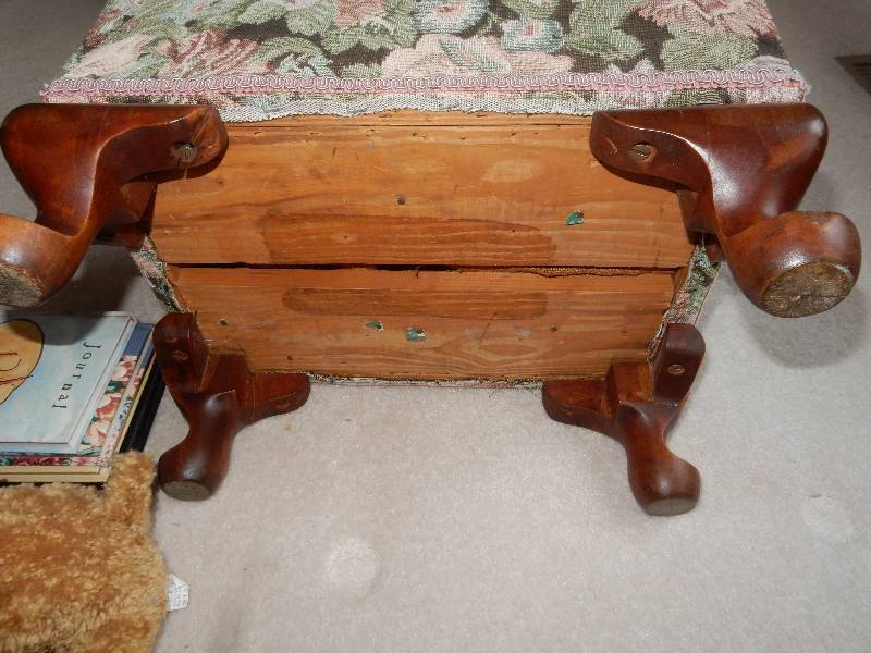 Upholstered with wood queen anne style leg foot stool. Approx 24in x 16in x 14in h.