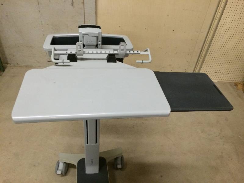 lot 49 image: Retails Used $600 Ergotron Sit Stand Height Adjustible Mobile PC Desktop Computer & Monitor Workstation Cart Portable Desk W Extra Slide Out Table Mousepad & STorage Locking Wheels - I want one