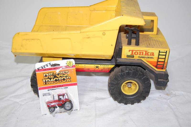 Large Toy Dump Truck and Small Die-Cast Tractor