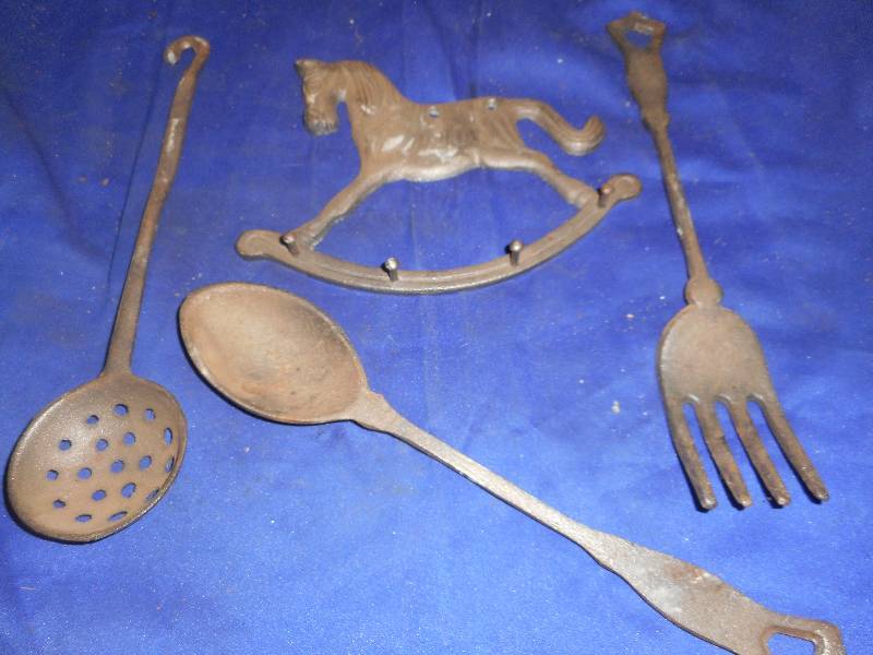 lot 14 image: ANTIQUE CAST IRON SPOONS AND HORSE