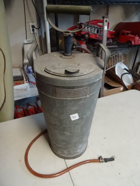lot 34 image: Vintage water pump can...