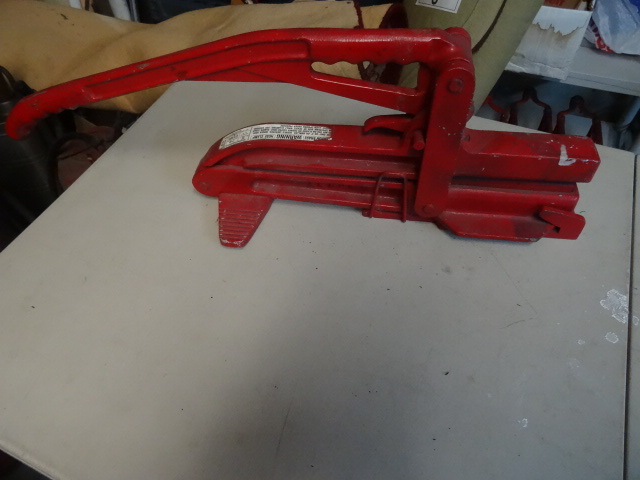 lot 61 image: Vintage Akron brass fire hose clamp