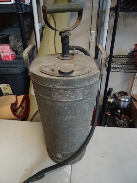 lot 68 image: Vintage Dobbins super bilt galvanized hand pump fire extinguisher.