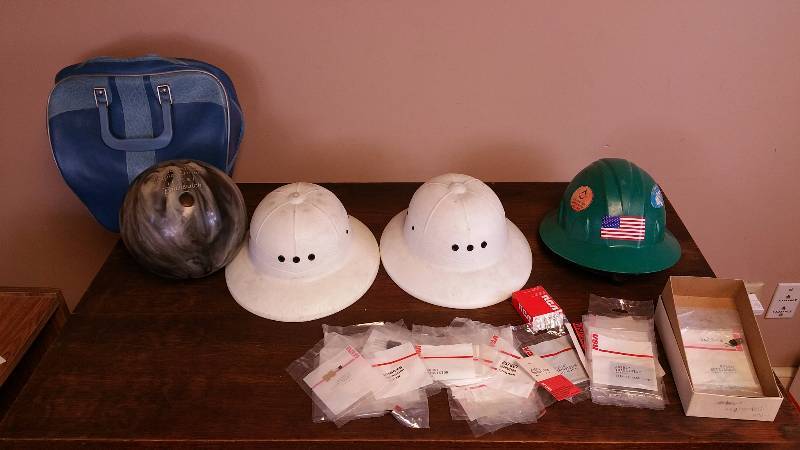 lot 115 image: Safari Hats, Hard Hat, Bowling Ball, and Many RCA Transistors